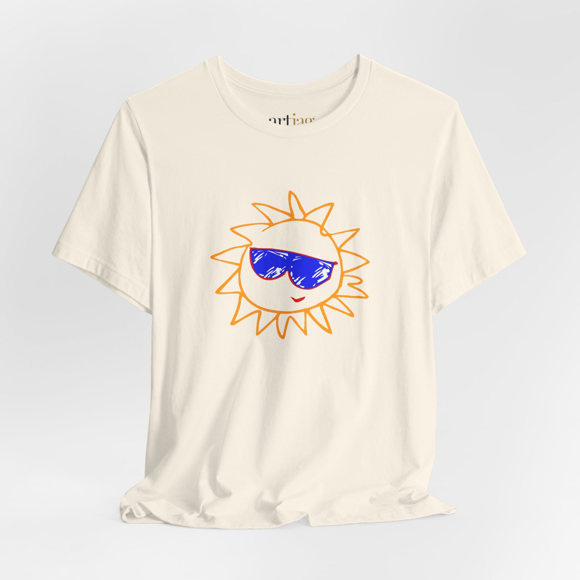 An off-white short-sleeve t-shirt with a cartoon sun graphic wearing blue sunglasses on the front, displayed against a light gray background - ARTJAG