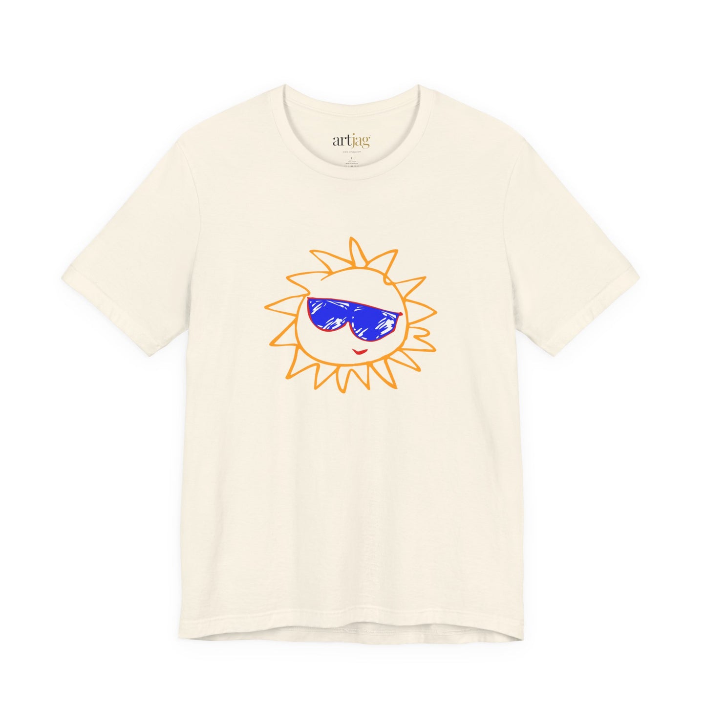 An off-white short-sleeve crewneck t-shirt featuring a cartoon sun graphic with orange outlines and blue sunglasses on the chest, displayed against a solid white background. The neck tag says artjag.
