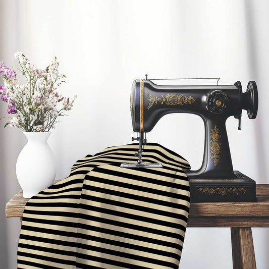 Spun Polyester Fabric with Black Bars on Tan, FASP-1014-051, on an antique sewing machine sitting on a desk with vase of beautiful flowers.