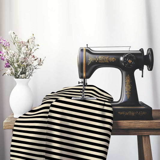 Spun Polyester Fabric with Black Bars on Beige, FASP-1015-051, on an antique sewing machine sitting on a desk with vase of beautiful flowers.