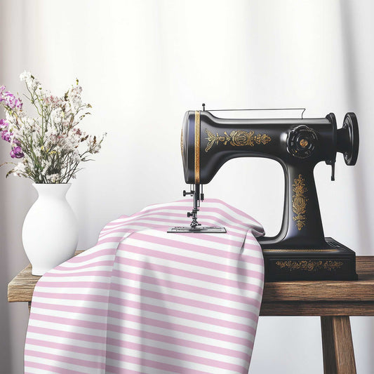 White Spun Polyester Fabric with Pink Bars, FASP-1081-051, on an antique sewing machine sitting on a desk with vase of beautiful flowers.