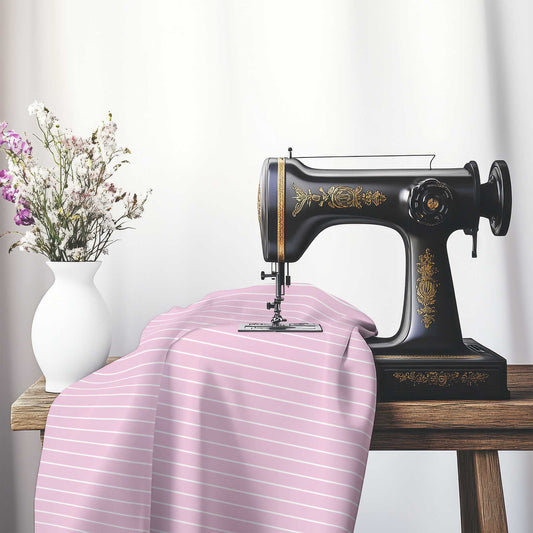 Spun Polyester Fabric with Fine White Stripes on Pink, FASP-1081-152, on an antique sewing machine sitting on a desk with vase of beautiful flowers.