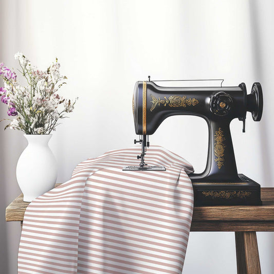 White Spun Polyester Fabric with Thin Salmon Bars, FASP-1139-241, on an antique sewing machine sitting on a desk with vase of beautiful flowers.