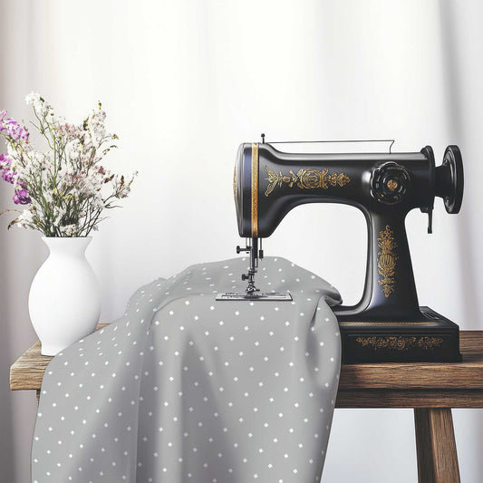 Spun Polyester Fabric with White Diamonds on Grey, FASP-1203-102, on an antique sewing machine sitting on a desk with vase of beautiful flowers.