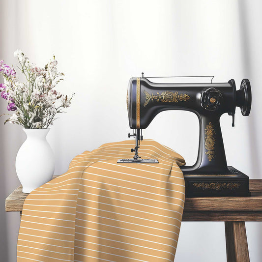 Spun Polyester Fabric with Fine White Stripes on Orange, FASP-1232-152, on an antique sewing machine sitting on a desk with vase of beautiful flowers.