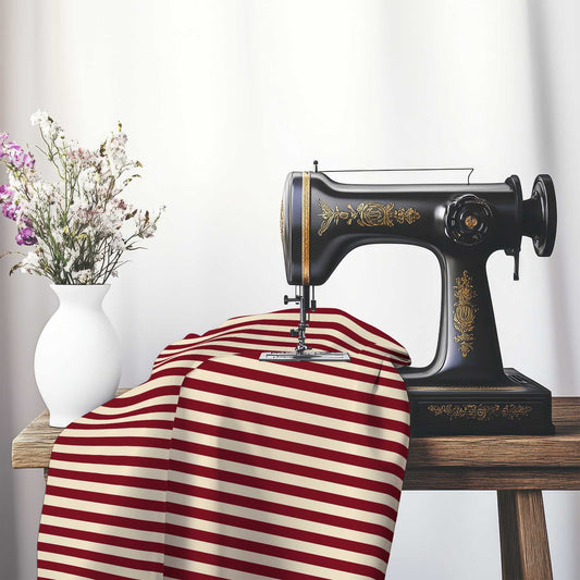 Spun Polyester Fabric with Burgundy Red Bars on Beige, FASP-1285-051, on an antique sewing machine sitting on a desk with vase of beautiful flowers.