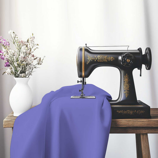 Purple Spun Polyester Handpainted Purple Watercolor Print, FASP-1300-999, on an antique sewing machine sitting on a desk with vase of beautiful flowers.
