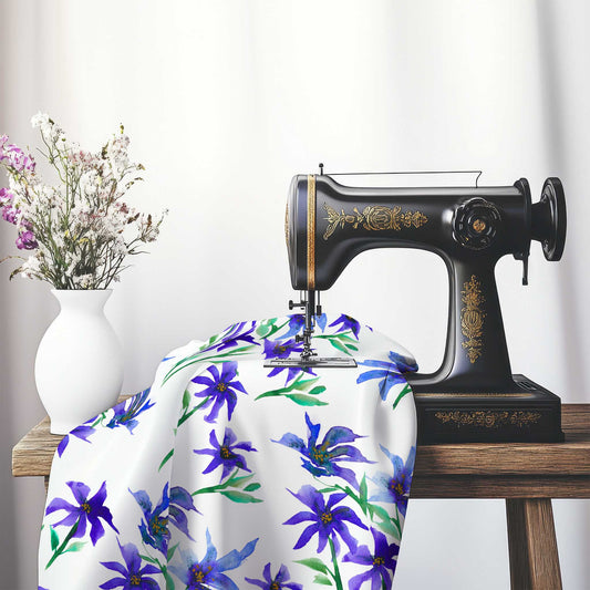 Printed Fabric with Handpainted Purple Watercolor Floral, FASP-1304, on an antique sewing machine sitting on a desk with vase of beautiful flowers.