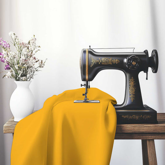 Yellow-Orange Spun Polyester Handpainted Purple Watercolor Print, FASP-1310-999, on an antique sewing machine sitting on a desk with vase of beautiful flowers.