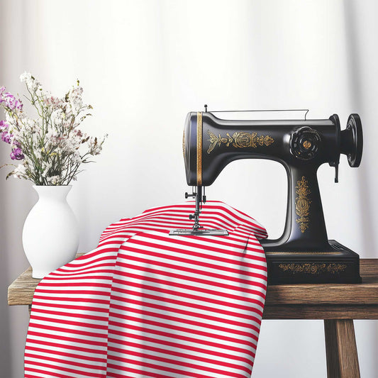 White Spun Polyester Fabric with Thin Red Bars, FASP-1330-241, on an antique sewing machine sitting on a desk with vase of beautiful flowers.