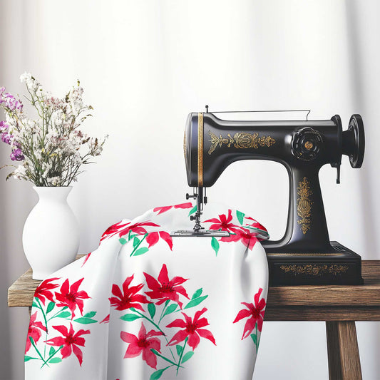 Printed Fabric with Handpainted Red Watercolor Floral, FASP-1334, on an antique sewing machine sitting on a desk with vase of beautiful flowers.