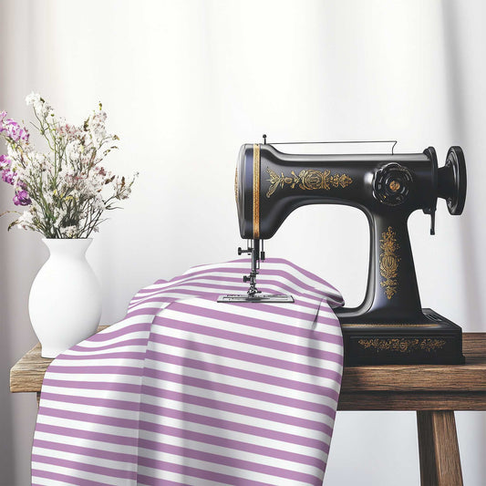White Spun Polyester Fabric with Mauve Bars, FASP-1360-051, on an antique sewing machine sitting on a desk with vase of beautiful flowers.