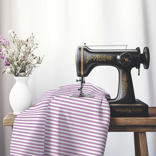 White Spun Polyester Fabric with Thin Mauve Bars, FASP-1360-241, on an antique sewing machine sitting on a desk with vase of beautiful flowers.