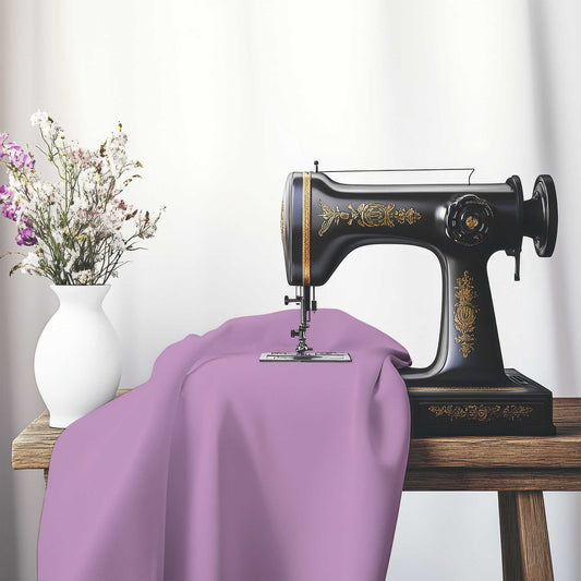 Mauve Spun Polyester Handpainted Purple Watercolor Print, FASP-1360-999, on an antique sewing machine sitting on a desk with vase of beautiful flowers.