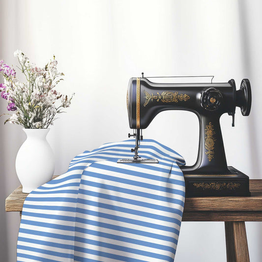 White Spun Polyester Fabric with Blue Bars, FASP-1400-051, on an antique sewing machine sitting on a desk with vase of beautiful flowers.