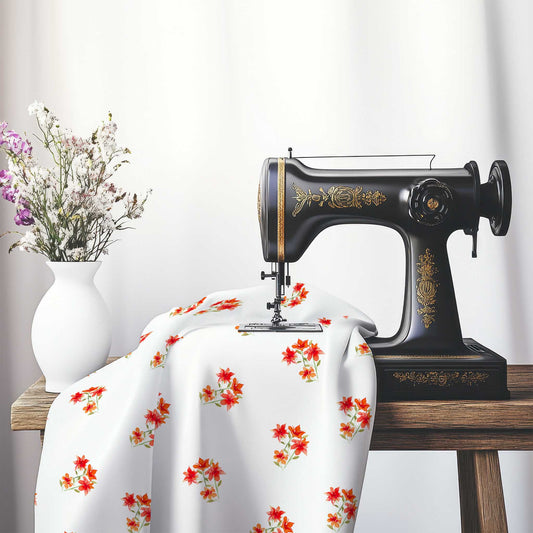Printed Fabric with Handpainted Red Watercolor Floral Pattern, FASP-1415, on an antique sewing machine sitting on a desk with vase of beautiful flowers.
