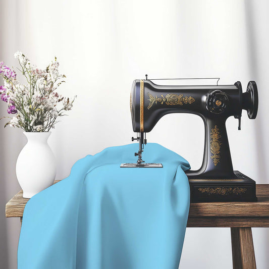 Blue Spun Polyester Handpainted Purple Watercolor Print, FASP-1430-999, on an antique sewing machine sitting on a desk with vase of beautiful flowers.