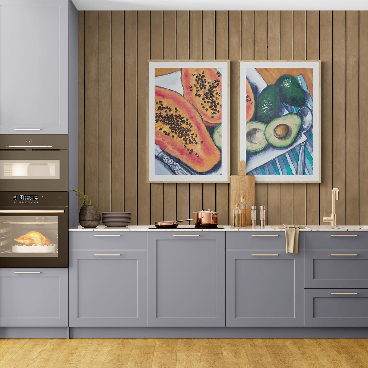 Two Papaya & Avocado Fine Art Prints | Styled in Sophisticated Contemporary Kitchen with Slate Blue Shaker Cabinets, Warm Oak Slat Feature Wall and Copper Cookware