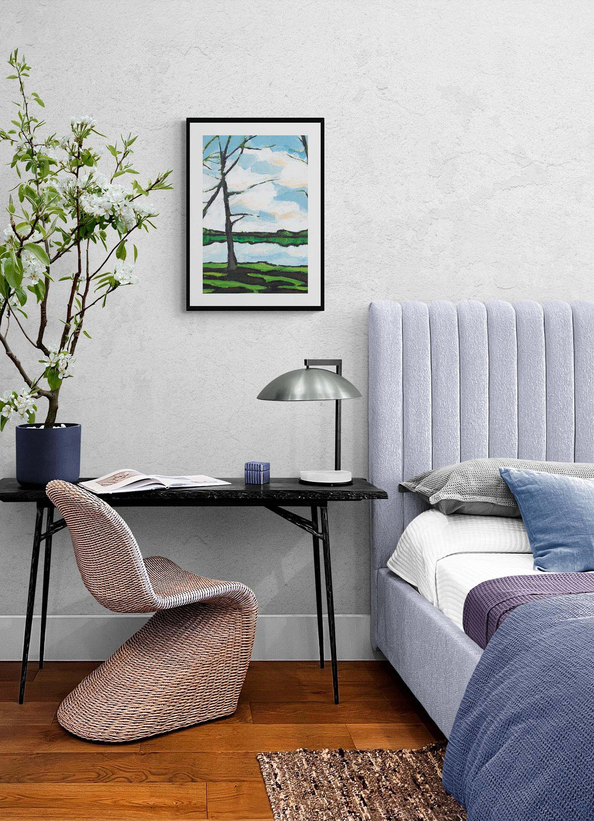 Lakeshore Landscape Fine Art Print | Styled in Serene Blue-Toned Bedroom with Lavender Channel-Back Headboard, Black Terrazzo Desk, Wicker Panton Chair and Flowering Cherry Branch