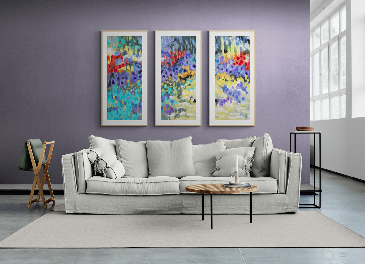 Wildflower Garden Fine Art Print Triptych | Styled in Airy Lavender Living Room with Oversized Grey Linen Sofa, Rattan Coffee Table, Minimal Black Side Table and Concrete Tile Floor