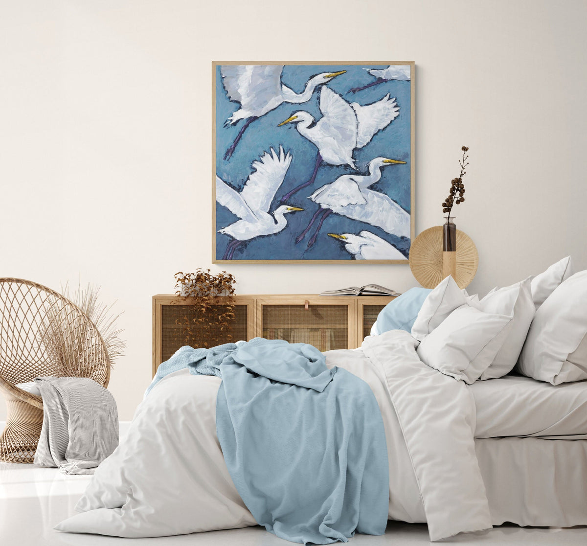 White Herons Fine Art Canvas Print | Styled in Coastal Boho Bedroom with Rattan Chair and Soft Blue Linen Bedding