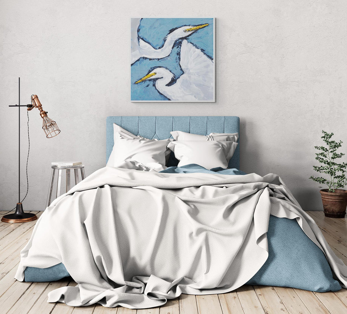 Heron Pair Fine Art Canvas Print | Styled in Rustic Coastal Bedroom with Blue Upholstered Headboard and Hardwood Floors