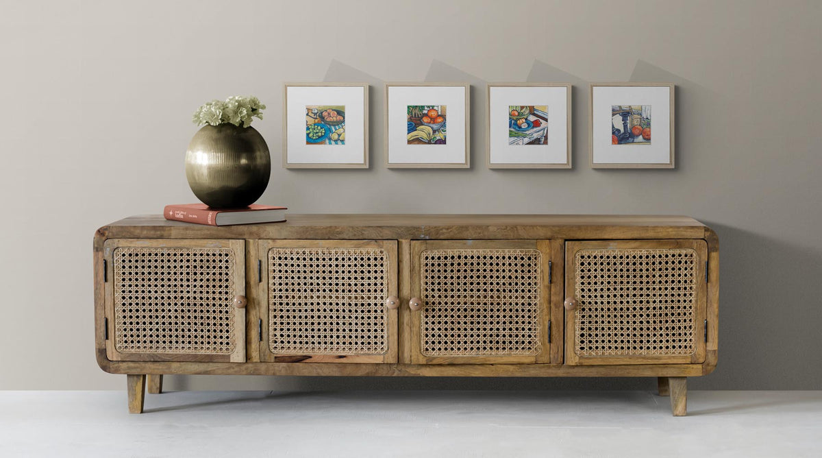 Four Fine Art Still Life Prints with Faux Mat Board | Styled in Warm Boho Living Room with Rattan Cane Media Console, Ribbed Brass Orb Vase and Greige Plaster Wall