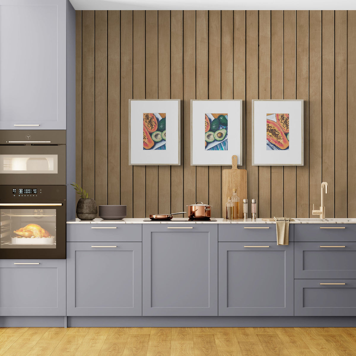 Three Papaya & Avocado Fine Art Prints with Faux Mat Board | Styled in Sophisticated Contemporary Kitchen with Slate Blue Shaker Cabinets, Warm Oak Slat Feature Wall and Copper Cookware
