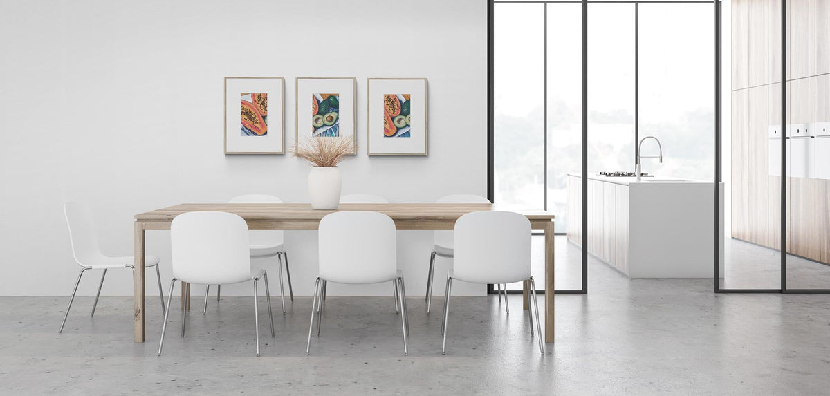 Three Papaya & Avocado Fine Art Prints with Faux Mat Board | Styled in Sleek Minimalist Dining Room with Oak Trestle Table, White Tulip Chairs and Steel Crittall Glass Partition