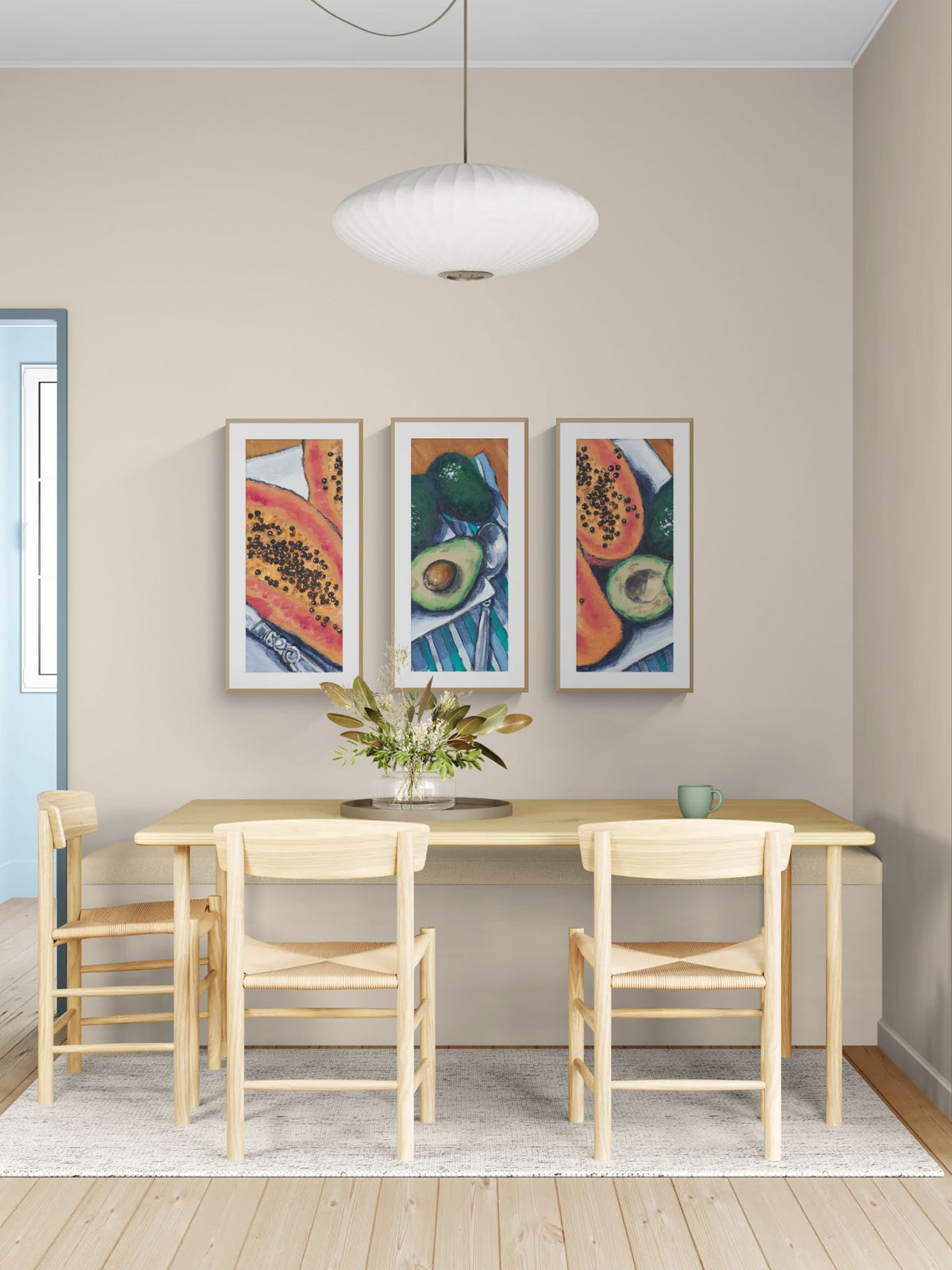 Papaya & Avocado Fine Art Print Triptych | Styled in Calm Scandinavian Dining Room with Blonde Wood Farmhouse Table, Rush Seat Chairs, White Saucer Pendant and Tropical Leaf Centrepiece